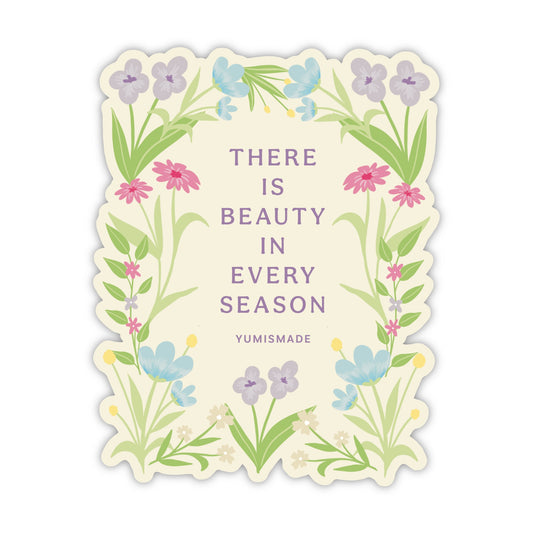 Decorative card with floral design and text 'There is beauty in every season' by YUMISMADE on a white background.