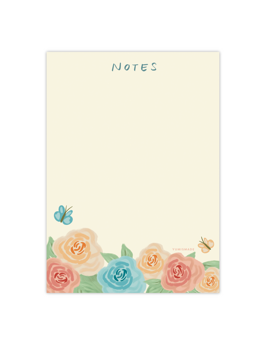 blank notepad with garden roses and butterlies