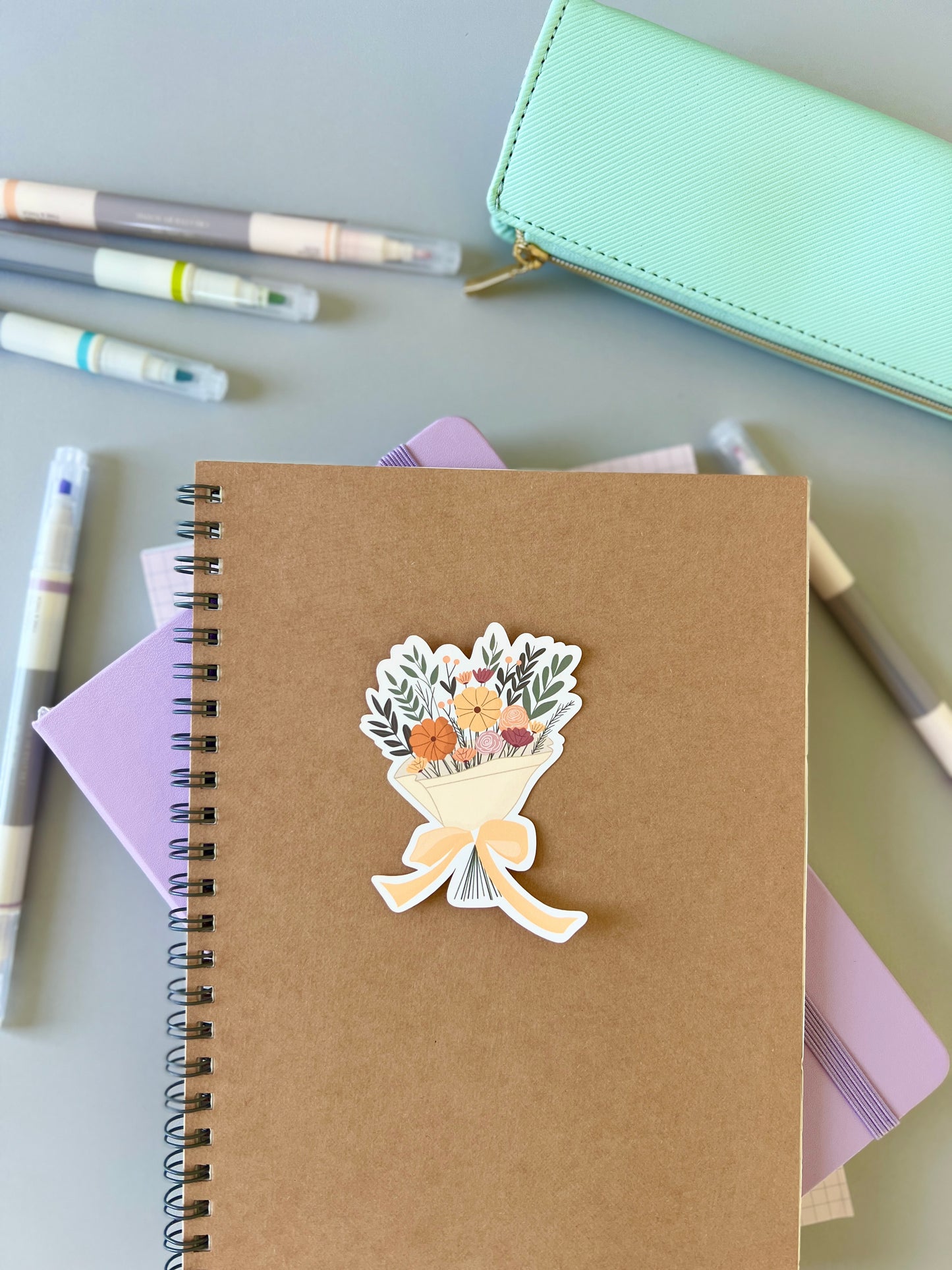 Flower bouquet sticker being used with other stationery products