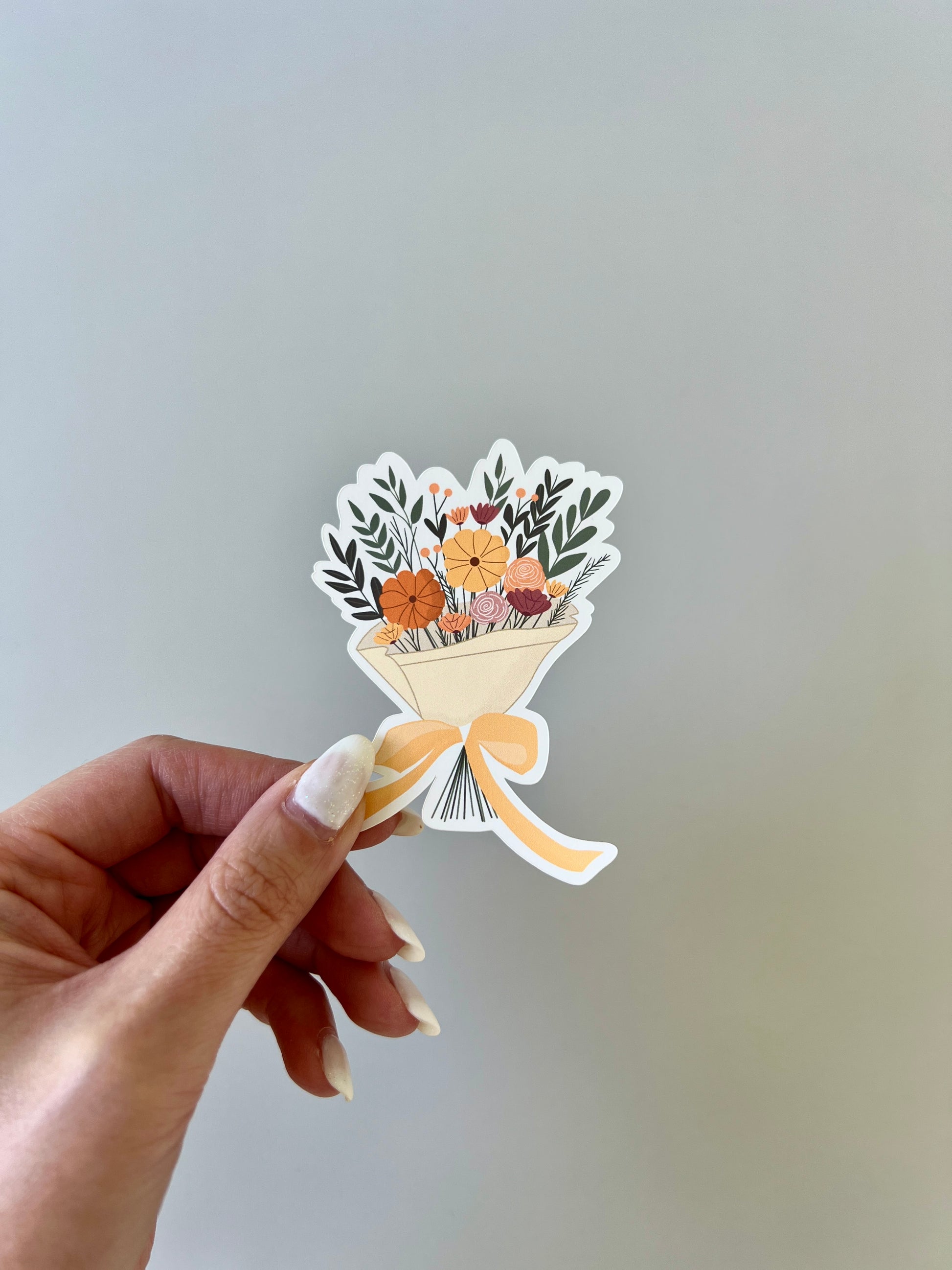 Holding a flower bouquet sticker for size reference