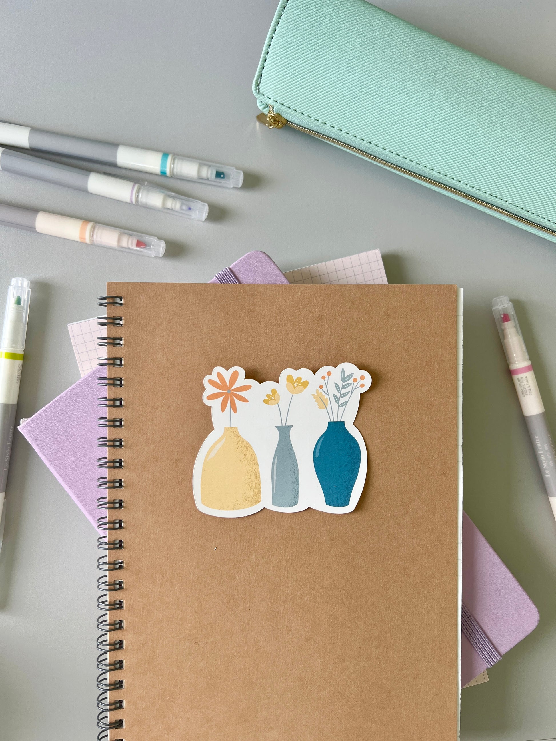 Flower vases sticker being used with other stationery products